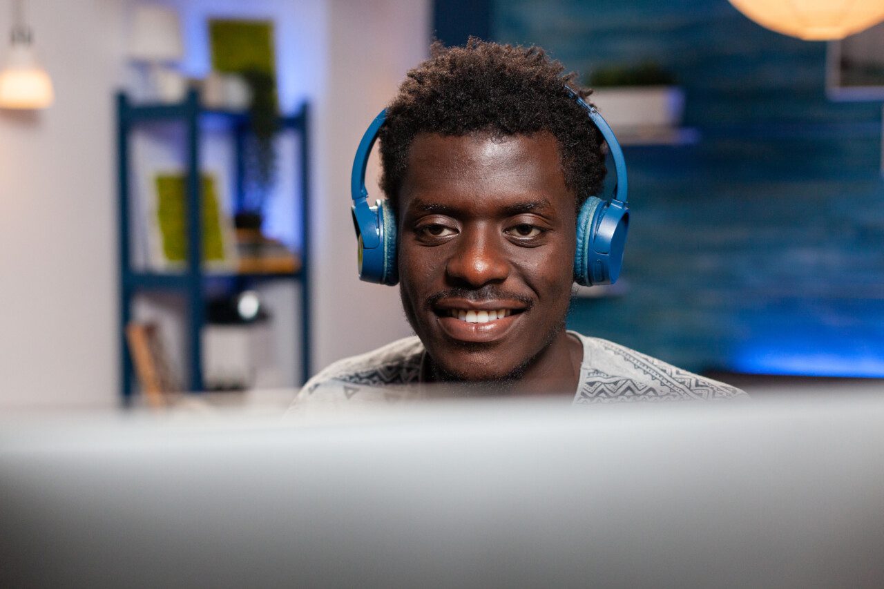 African american young employee using computer for remote work employé nocode